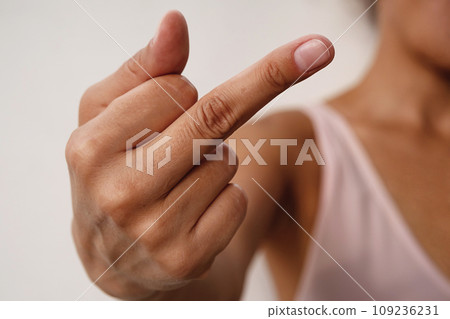 Woman showing middle finger gesture. 109236231