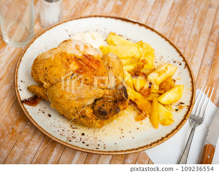 Tasty baked chicken and potatoes 109236554