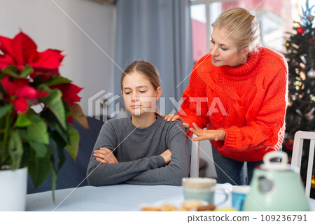 Mom soothes her teen daughter after domestic fight 109236791