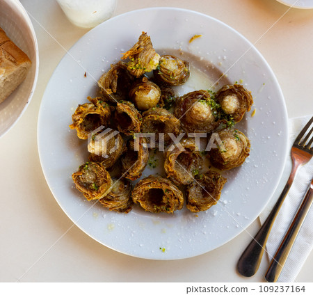 Aragonese Cuisine - fried lamb small iIntestine rings with garlic Aragonese Cuisine - fried lamb small iIntestine rings with garlic 109237164