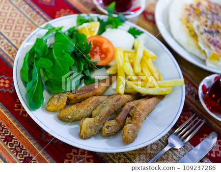 Roasted red mullet with potatoes and vegetables Roasted red mullet with potatoes and vegetables 109237286