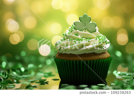 St Patrick's day concept - cupcake with shamrock topper St Patrick's day concept - cupcake with shamrock topper 109238263