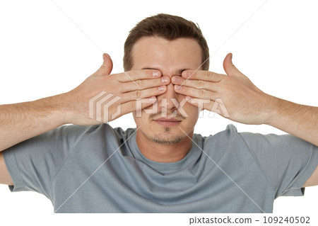 man covering eyes with hands on white background 109240502
