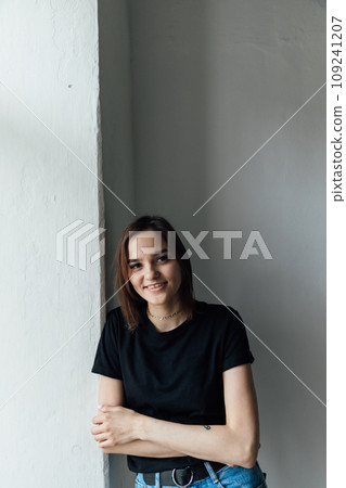 Portrait of beautiful young brunette woman in home clothes Portrait of beautiful young brunette woman in home clothes 109241207