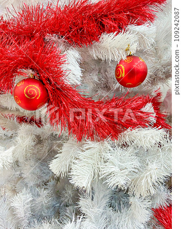 Red baubles with golden ornament on pine tree brenches Red baubles with golden ornament on pine tree brenches 109242087