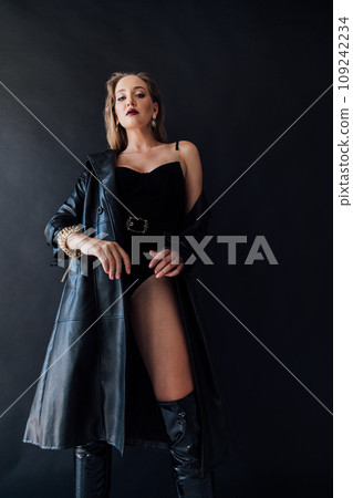 Beautiful fashionable woman in latex clothes and high boots 109242234