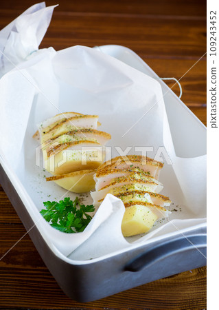 Raw potatoes stuffed with lard and spices. Raw potatoes stuffed with lard and spices. 109243452