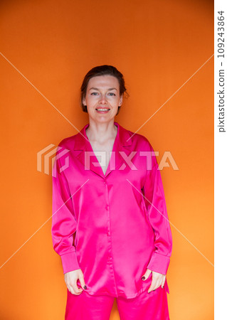 Beautiful fashionable woman in crimson silk pajamas Beautiful fashionable woman in crimson silk pajamas 109243864