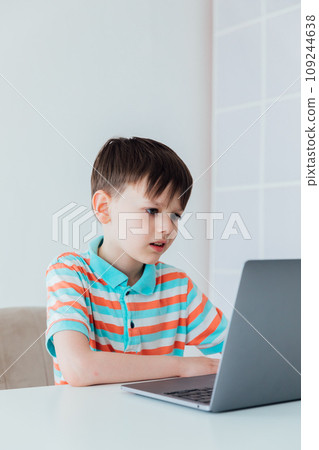 Boy with laptop online learning internet job 109244638