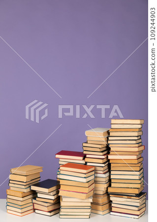 Lots of stacks of educational books to read as a background Lots of stacks of educational books to read as a background 109244903
