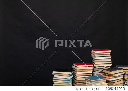 Education learning concept with opening book or textbook in old library Education learning concept with opening book or textbook in old library 109244923