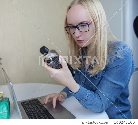 Woman reads instructions for food products at home. Checking labels on goods. Study of product compositions. Search Internet for descriptions of product gradients. Useful or harmful. Nutritionology 109245109