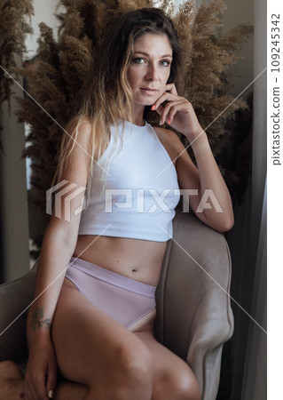 Portrait of beautiful slender woman in lingerie in bedroom 109245342