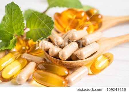 Alternative medicine herbal organic capsule with vitamin E omega 3 fish oil, mineral, drug with herbs leaf natural supplements for healthy good life. Alternative medicine herbal organic capsule with vitamin E omega 3 fish oil, mineral, drug with herbs leaf natural supplements for healthy good life. 109245826