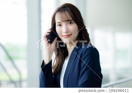Business woman making a phone call Business woman making a phone call 109246011