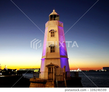 Illuminated white wooden lighthouse Illuminated white wooden lighthouse 109246599
