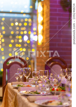 Served festive table with snacks, glasses, glasses, cutlery and napkins for a banquet 109246634