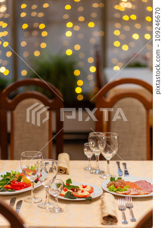 Served festive table with snacks, glasses, glasses, cutlery and napkins for a banquet 109246670