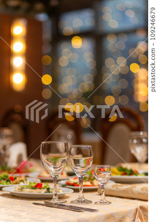 Served festive table with snacks, glasses, glasses, cutlery and napkins for a banquet 109246679