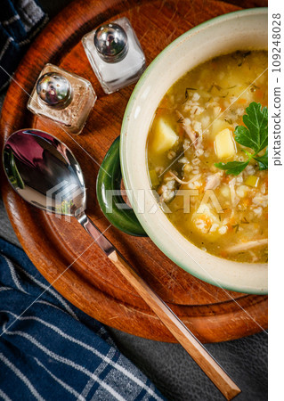 Barley soup with vegetables and chicken. 109248028
