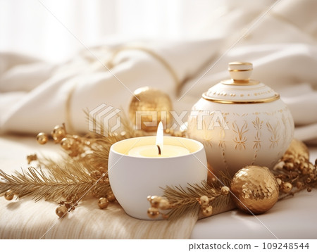 Cozy winter home decor arrangement with burning candles, holiday room interior decorations in white and gold tones Cozy winter home decor arrangement with burning candles, holiday room interior decorations in white and gold tones 109248544