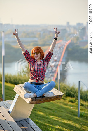 Stylish Redhead Woman in Urban Autumn Fashion. Smiling Stylish Redhead Woman in Urban Autumn Fashion. Smiling 109248900