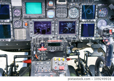 Interior view of helicopter Agusta cockpit with control pedals, dashboard, displays, selected focus Interior view of helicopter Agusta cockpit with control pedals, dashboard, displays, selected focus 109249916