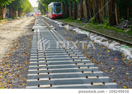 Laying new tram rails on new concrete sleepers with pads that reduces vibration and noise emission Laying new tram rails on new concrete sleepers with pads that reduces vibration and noise emission 109249938
