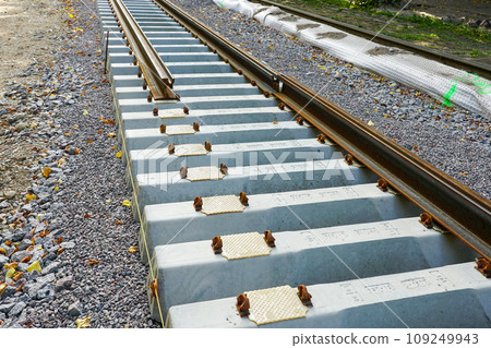 Laying new tram rails on new concrete sleepers with pads that reduces vibration and noise emission 109249943
