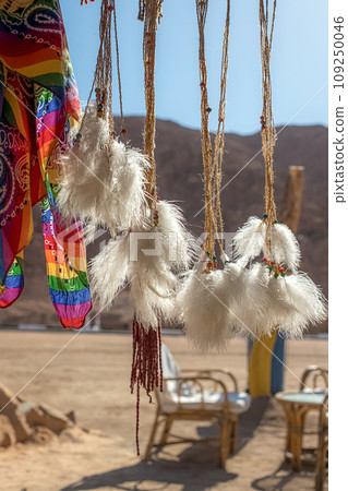 A dream catcher against the backdrop of the desert and mountains in Egypt A dream catcher against the backdrop of the desert and mountains in Egypt 109250046