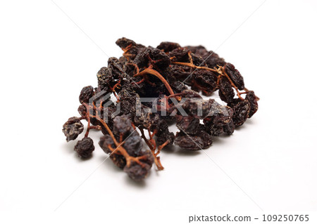 Dried grapes with branches on white background Dried grapes with branches on white background 109250765