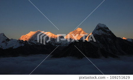 Bright lit Mt Everest at sunset, sea of fog, Nepal. 109251629