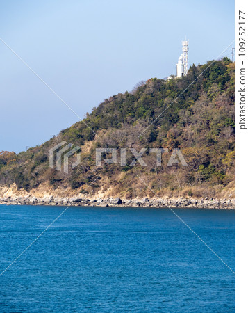 Jizosaki Lighthouse. A lighthouse standing on Jizosaki (Shakagahana) at the southern tip of the Santo Peninsula on Shodoshima. Shodoshima Town, Shodo District, Kagawa Prefecture. (Vertical composition) 109252177