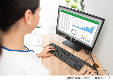 Woman analyzing data for marketing plan. 109252603
