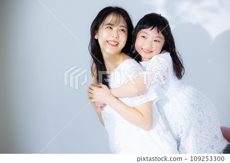 Girl hugging her mother 109253300