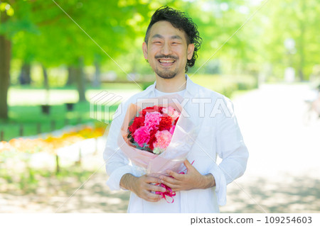 Mother's Day image: Man holding a bouquet of flowers 109254603