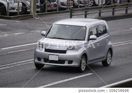 Compact car road driving Compact car road driving 109256686