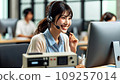 A Japanese female part-time worker smiles as she makes outgoing calls at a call center. 109257014