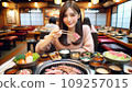 A cute Japanese woman eating Yakiniku 109257015