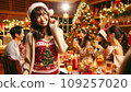 A cute Japanese woman having a Christmas party 109257020