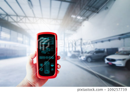 EV Electric vehicle checking tools in a technician hand for electric car maintenance and inspection EV Electric vehicle checking tools in a technician hand for electric car maintenance and inspection 109257739