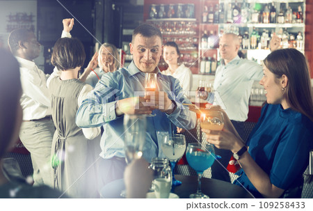Businessman having fun at corporate party 109258433