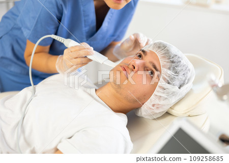 doctor deftly wields Skin Scrubbe 109258685