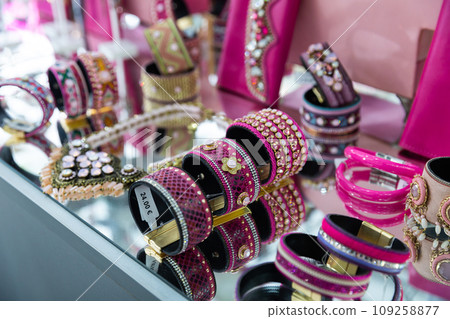 Various adornments on showcase in bijouterie shop Various adornments on showcase in bijouterie shop 109258877