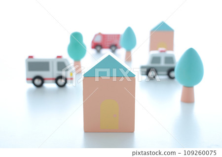 A diorama of a safe and livable cityscape with miniature houses and lush greenery. A diorama of a safe and livable cityscape with miniature houses and lush greenery. 109260075
