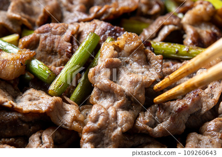 Stir-fried beef and garlic sprouts, cooking scene. Stir-fried beef and garlic sprouts, cooking scene. 109260643