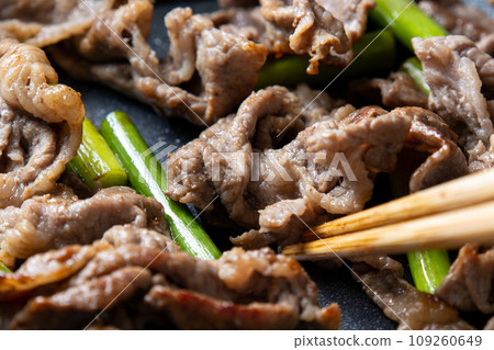 Stir-fried beef and garlic sprouts, cooking scene. Stir-fried beef and garlic sprouts, cooking scene. 109260649
