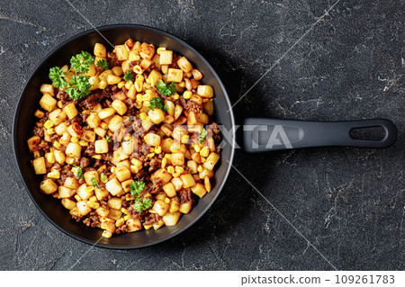 Beef Hash with roasted corn, garlic and parsley 109261783