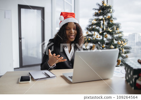 African businesswoman talking to client over video call. 109264564