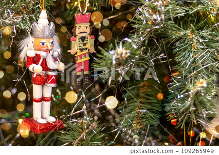 Nutcracker on Christmas tree. Copy space. Postcard Nutcracker on Christmas tree. Copy space. Postcard 109265949